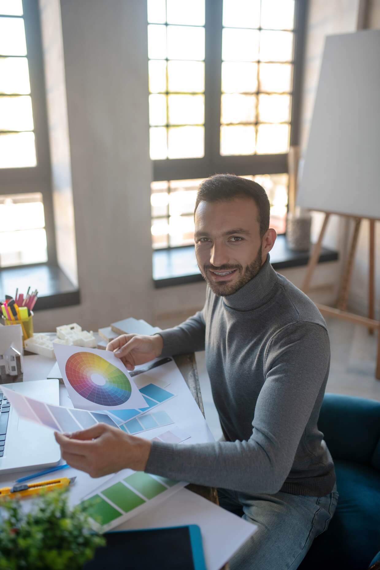 smiling interior designer feeling good while worki tzvngn8.jpg